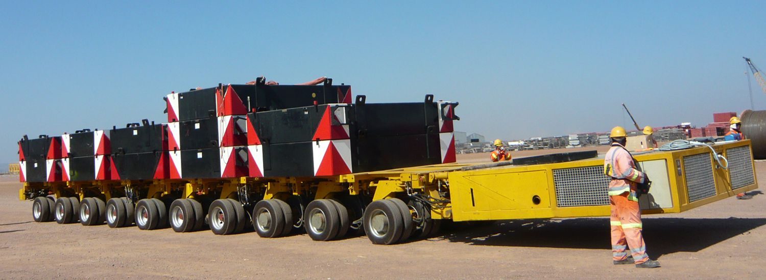 Self-propelled transporter (SPT/PST) with mechanical linkage steering